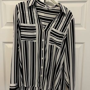Long sleeve Women’s button down shirt. Black and white striped.